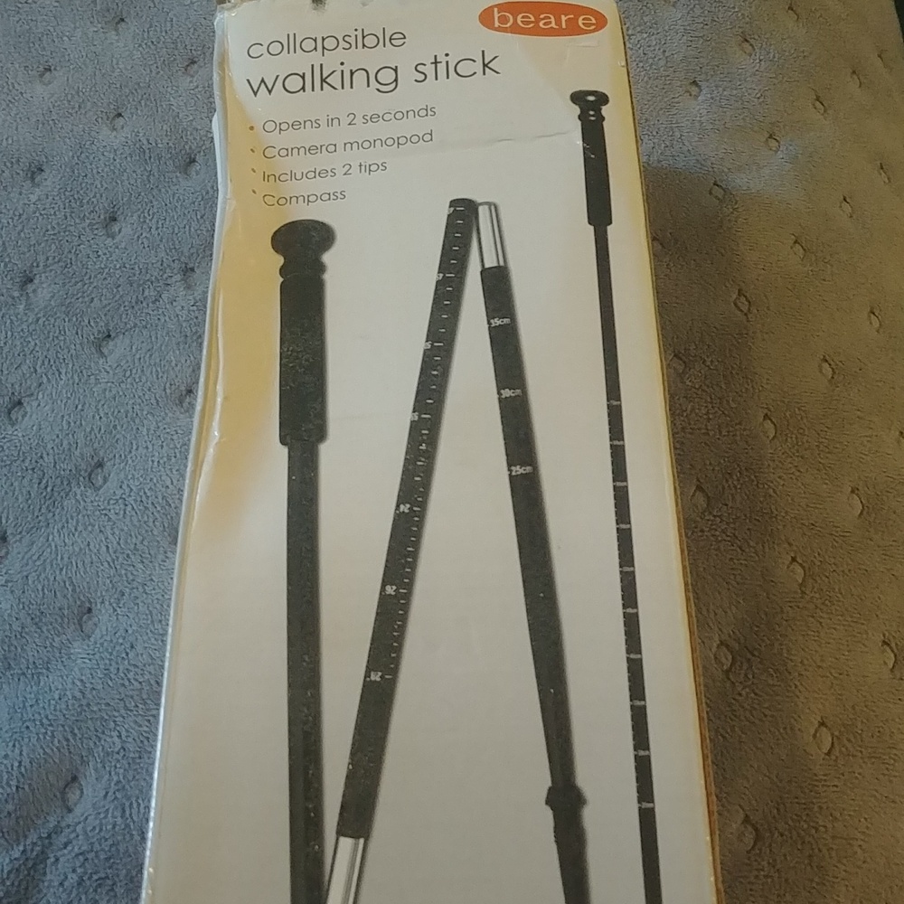 Collapsable walking stick with compass and camera monopad